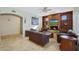 Spacious living room with a fireplace and built-in shelving at 1044 W Indian Hills Pl, Phoenix, AZ 85023