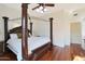 Serene main bedroom boasts a king-size bed and hardwood floors at 1044 W Indian Hills Pl, Phoenix, AZ 85023