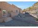 Side yard with stone seating and desert landscape at 1044 W Indian Hills Pl, Phoenix, AZ 85023