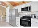 Modern kitchen with stainless steel appliances and white shaker cabinets at 1238 E Kristal Way, Phoenix, AZ 85024