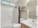 Clean bathroom with shower/tub combo and wood vanity at 14462 W Avalon Dr, Goodyear, AZ 85395