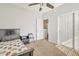 Cozy bedroom with a ceiling fan and ample closet space at 14462 W Avalon Dr, Goodyear, AZ 85395