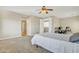 Serene bedroom with ensuite bathroom access and ceiling fan at 14462 W Avalon Dr, Goodyear, AZ 85395