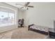 Charming bedroom with large window and a workspace at 14462 W Avalon Dr, Goodyear, AZ 85395