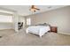 Comfortable bedroom with carpeted floors and built-in workspace at 14462 W Avalon Dr, Goodyear, AZ 85395
