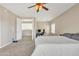 Spacious bedroom with carpeted floors and ceiling fan at 14462 W Avalon Dr, Goodyear, AZ 85395