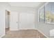 Bright bedroom with double doors and window blinds at 14462 W Avalon Dr, Goodyear, AZ 85395