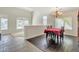 Bright dining room featuring a charming table setting and hardwood floors at 14462 W Avalon Dr, Goodyear, AZ 85395