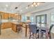 Spacious kitchen with an island, granite countertops, and wooden cabinets at 14462 W Avalon Dr, Goodyear, AZ 85395