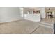 Living room with neutral carpet and tile flooring at 14462 W Avalon Dr, Goodyear, AZ 85395