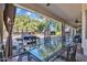 Outdoor dining area on the patio with glass table and chairs, overlooking the pool at 14462 W Avalon Dr, Goodyear, AZ 85395