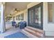 Covered patio with seating area and ceiling fan at 14462 W Avalon Dr, Goodyear, AZ 85395
