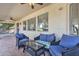 Covered patio with seating area and ceiling fan at 14462 W Avalon Dr, Goodyear, AZ 85395