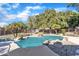 Relaxing kidney-shaped pool surrounded by lush landscaping and a rock waterfall at 14462 W Avalon Dr, Goodyear, AZ 85395