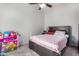 bedroom with a double bed and toy storage at 3030 S Alma School Rd # 12, Mesa, AZ 85210