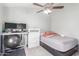 Bright bedroom with a double bed, desk, and exercise ball at 3030 S Alma School Rd # 12, Mesa, AZ 85210