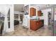 Modern kitchen with wood cabinets, stainless steel appliances, and a double sink at 3030 S Alma School Rd # 12, Mesa, AZ 85210