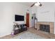 Living area with a fireplace and built-in shelving at 3030 S Alma School Rd # 12, Mesa, AZ 85210