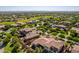 Aerial view of upscale homes, lush landscaping, and a golf course at 3525 N Carlton St, Buckeye, AZ 85396