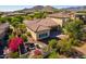 Aerial view of backyard with patio, seating area and bougainvillea at 3525 N Carlton St, Buckeye, AZ 85396