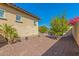 Landscaped backyard with desert plants and seating area at 3525 N Carlton St, Buckeye, AZ 85396