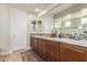 Elegant bathroom with double vanity and granite countertops at 3525 N Carlton St, Buckeye, AZ 85396