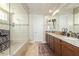 Large bathroom with double vanity, walk-in shower, and granite countertops at 3525 N Carlton St, Buckeye, AZ 85396