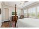 Bright bedroom with wood floors, plantation shutters and a comfortable bed at 3525 N Carlton St, Buckeye, AZ 85396