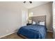 Charming bedroom with blue bedding and a tufted headboard at 3525 N Carlton St, Buckeye, AZ 85396