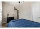 Well-lit bedroom with blue bedding and window shutters at 3525 N Carlton St, Buckeye, AZ 85396