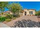Beautiful desert landscaping with a paver driveway and walkway at 3525 N Carlton St, Buckeye, AZ 85396