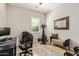 Bright home office features built-in shelving and plenty of space for a desk and workout equipment at 3525 N Carlton St, Buckeye, AZ 85396