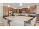 Island kitchen with granite countertops, stainless steel appliances, and ample cabinetry at 3525 N Carlton St, Buckeye, AZ 85396