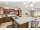 Spacious kitchen boasts granite countertops, stainless steel appliances, and an expansive island at 3525 N Carlton St, Buckeye, AZ 85396