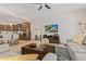 Living area showcasing an open floor plan, comfortable furniture, and a flat-screen TV at 3525 N Carlton St, Buckeye, AZ 85396