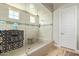 Large walk-in shower with glass enclosure and tile surround at 3525 N Carlton St, Buckeye, AZ 85396