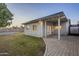 Spacious backyard with grassy area, paved patio, and block wall at 3743 W Dailey St, Phoenix, AZ 85053