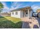 House backyard with covered patio and grassy area at 3743 W Dailey St, Phoenix, AZ 85053