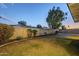 Landscaped backyard with grassy lawn and a curved pathway at 3743 W Dailey St, Phoenix, AZ 85053