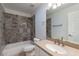 Bathroom with tile shower and updated vanity at 3743 W Dailey St, Phoenix, AZ 85053