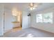 Bedroom with carpet, ceiling fan and en-suite bathroom at 3743 W Dailey St, Phoenix, AZ 85053