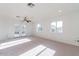 Spacious bedroom with carpet, ceiling fan, and French doors at 3743 W Dailey St, Phoenix, AZ 85053