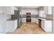 Updated kitchen, featuring stainless steel appliances and white cabinets at 3743 W Dailey St, Phoenix, AZ 85053