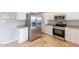 Modern kitchen with stainless steel appliances and white cabinets at 3743 W Dailey St, Phoenix, AZ 85053