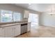 White kitchen cabinets, stainless steel dishwasher, and tile floor at 3743 W Dailey St, Phoenix, AZ 85053
