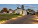 Landscaped side yard with gravel driveway and lighting at 3743 W Dailey St, Phoenix, AZ 85053
