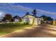 Landscaped side yard with gravel driveway and lighting at 3743 W Dailey St, Phoenix, AZ 85053