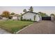 Landscaped side yard with gravel driveway and lighting at 3743 W Dailey St, Phoenix, AZ 85053