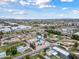 Aerial view of a single Gathering home with a large yard and surrounding neighborhood at 394 E Redfield Rd, Chandler, AZ 85225