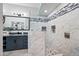 Large walk-in shower with marble tile and glass enclosure at 394 E Redfield Rd, Chandler, AZ 85225